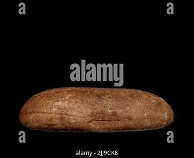 Image of a loaf of rye bread on a black background Stock Photo