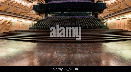Movie Theater with empty seats and projector. Stock Photo