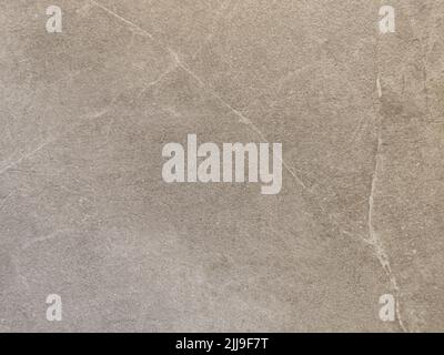 Perfect background shot for designers of a beautiful unique beige brown wall with light colored cracks Stock Photo