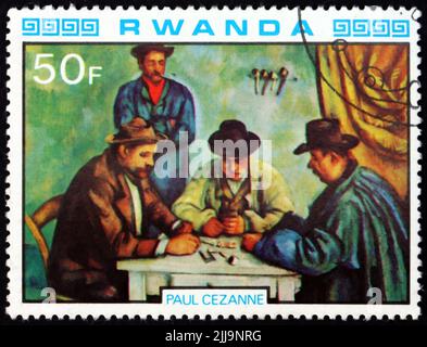 RWANDA - CIRCA 1980: a stamp printed in Rwanda shows The Card Players, Painting by Paul Cezanne, French Painter, circa 1980 Stock Photo