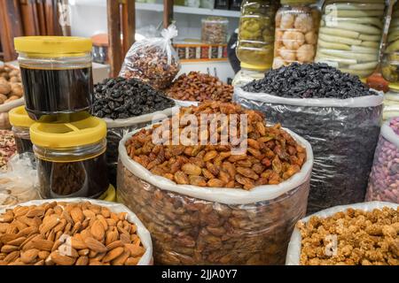 Delicious nuts and dried fruits at the traditional Turkish food market. Stock Photo