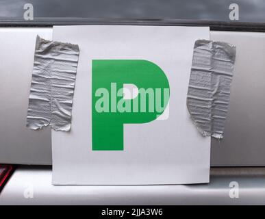 Probationary Plate (P Plates) On The Back Of A Car, Attached with Duct Tape Stock Photo