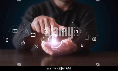Businessman using phone and touching on virtual screen contact icons. Contact us, Customer support hotline people connect. Man hands touch smartphone Stock Photo