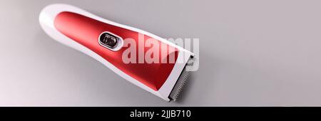Electric razor for cutting hair on gray background Stock Photo
