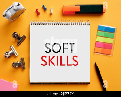 The word soft skills written on a notebook on business desktop table. People, communication, interaction, listening skills concept. Stock Photo