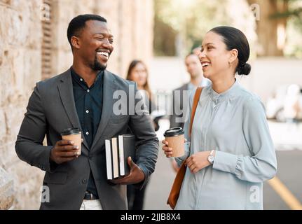 Id love to run this case by you. two lawyers walking to work while having a conversation. Stock Photo