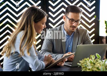 Portrait of success business colleagues working, smiling together in office. Stock Photo