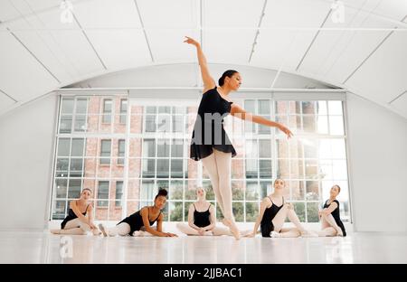 I played them for you. a beautiful ballet dancer practicing her routine. Stock Photo