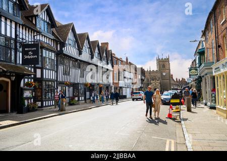 the shakespeare hotel timber framed building with the guild chapel in the distance chapel street stratford upon avon UK Stock Photo