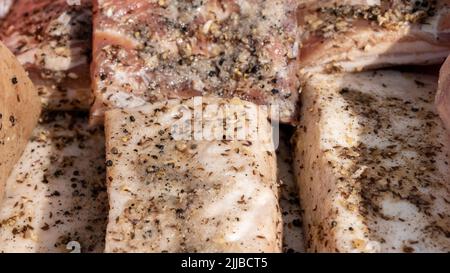 Salted traditional Ukrainian bacon. Cooked in spices. A large chunk of fresh fat. Ukrainian lard, traditional food Stock Photo