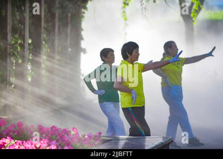 ORDOS, CHINA - JULY 25, 2022 - Residents work out at a park in Ordos, North China's Inner Mongolia Autonomous Region, July 25, 2022. Stock Photo