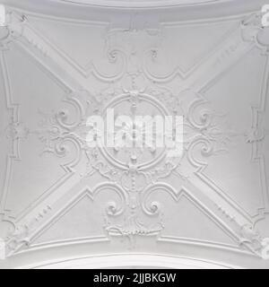 Decorative item ceiling socket made of white plaster. Relief stucco interior Stock Photo