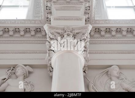 Elements of architectural decorations of buildings, columns and tops, old gypsum stucco molding Stock Photo