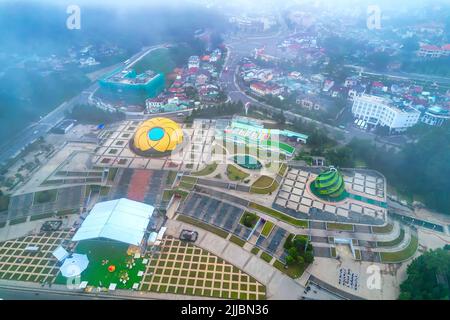 Aerial view of Sunflower Building at Lam Vien Square with square, supermarket, park below. Tourist city developed in Da Lat, Vietnam. Stock Photo