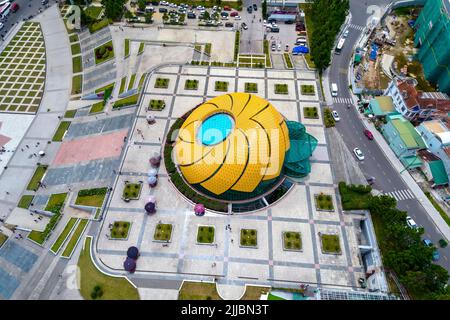 Aerial view of Sunflower Building at Lam Vien Square with square, supermarket, park below. Tourist city developed in Da Lat, Vietnam. Stock Photo