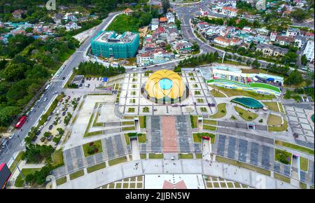 Aerial view of Sunflower Building at Lam Vien Square with square, supermarket, park below. Tourist city developed in Da Lat, Vietnam. Stock Photo