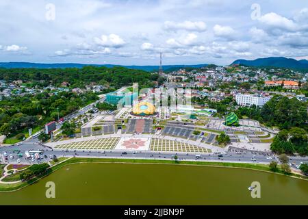 Aerial view of Sunflower Building at Lam Vien Square with square, supermarket, park below. Tourist city developed in Da Lat, Vietnam. Stock Photo