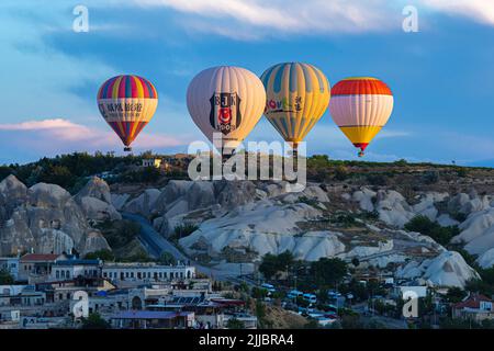 GOREME/TURKEY - June 27, 2022: hot air balloons fly over the city of goreme. Turkey. Stock Photo