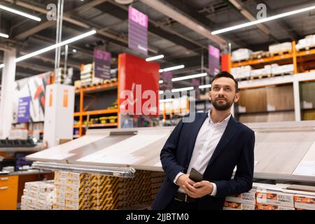 portrait of a store manager of floor finishing materials in a business suit Stock Photo