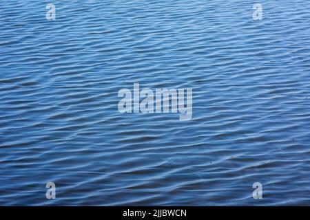 Blue tones water waves surface as background Stock Photo