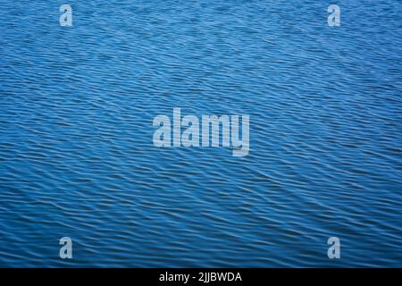 Blue tones water waves surface as background Stock Photo