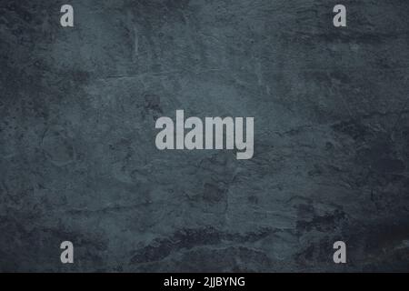Gloomy black granite stone surface texture background Stock Photo