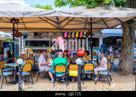 Resturant terrace, Korzo, Petőfi sétány, main pedestrian street by the beach, Siofok, Hungary Stock Photo