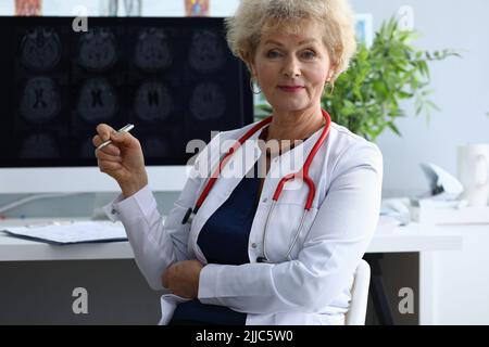 Portrait of elderly woman doctor in field of medicine Stock Photo