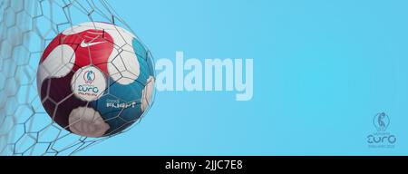 Guilherand-Granges, France - July 25, 2022. Soccer ball in net with official logo of UEFA Women's Cup Euro 2022 championship in England. Stock Photo