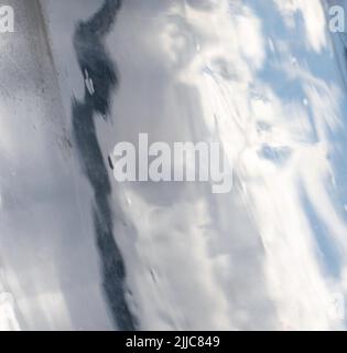Water in flow. Blue abstract background,  - lines and bands blurred by water motion. Stock Photo