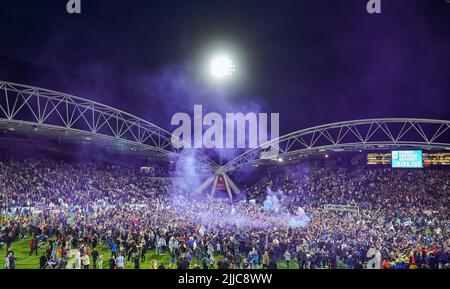 File photo dated 16-05-2022 of Huddersfield Town fans celebrating getting through to the play off final on the pitch. Pitch invaders at Premier League and English Football League matches will receive an automatic club ban under new measures to tackle increased anti-social behaviour among fans. Issue date: Monday July 25, 2022. Stock Photo