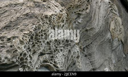 Bizarrely weathered rocks on a beach near Zarautz in Northern Spain Stock Photo