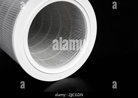 Dust contaminated home air purifier filter on dark background Stock Photo