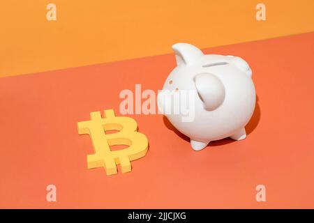 Bitcoin blockchain technology or mining money vitrual economy and piggy bank. Minimal creative concept of crypto business profit in crisis and financi Stock Photo