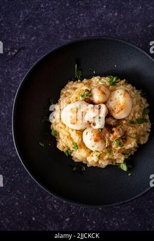 Cuttlefish risotto with garlic butter Stock Photo - Alamy