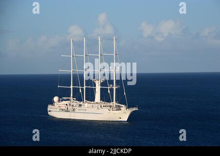 The Wind Star a Small 4-masted Luxury Cruise Sailing Yacht at Anchor in the Bay at Basseterre, St Kitts & Nevis in the Caribbean. Stock Photo