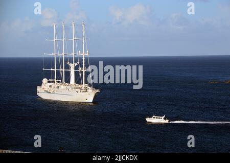 The Wind Star a Small 4-masted Luxury Cruise Sailing Yacht at Anchor in the Bay at Basseterre, St Kitts & Nevis in the Caribbean. Stock Photo