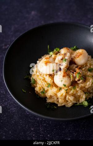 Cuttlefish risotto with garlic butter Stock Photo - Alamy