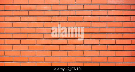 Brick wall of fence as texture or background, long picture of new modern brickwork Stock Photo