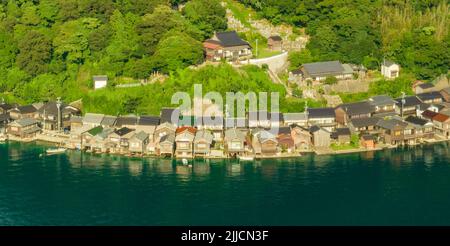 Aerial view of boathouses in row along coast at Ine, Kyoto Stock Photo