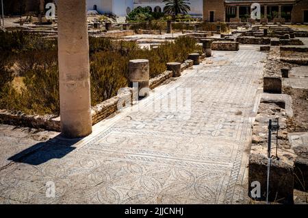 Original Roman mosaics left in situ in the archeological park at the El Jem Archeological Museum in Tunisia. Stock Photo