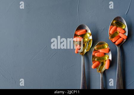 pills capsule spoons dosage drug administration Stock Photo