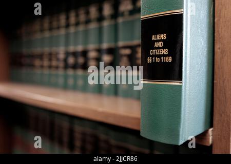 Lawbooks on shelf title for study legal knowledge Aliens and citizens Stock Photo