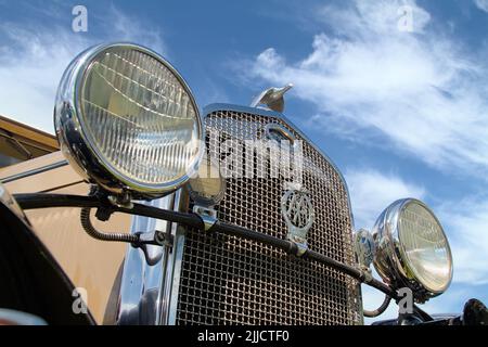 Headlights And Front Radiator Grill Of A Model A Ford 1930 Showing The Quail Car Mascot, Christchurch UK Stock Photo