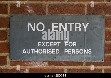 Old metal No Entry sign on a brick wall Stock Photo