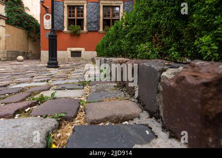 Cobbled road, an old road made of stones. Stock Photo