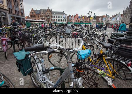 Bruges, Belgium, city street scene, bicycles parked at city square, cycling is common way of transportation through cities in benelux countries Stock Photo