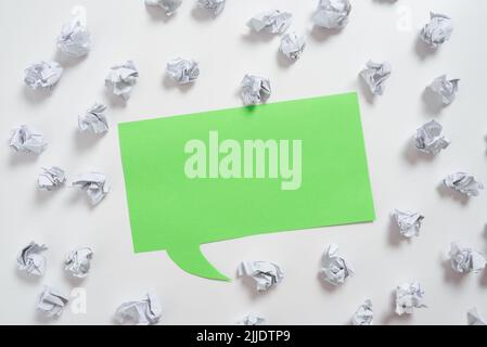 Paper Wraps Placed Around Speech Bubble With Important Information. Stock Photo