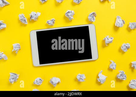 Paper Wraps Placed Around Tablet With Important Informations. Stock Photo