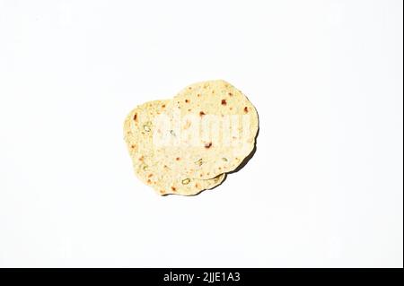 Flat lay freshly baked homemade chapati, pita bread, flatbread, isolated over white background. Still life. Copy space Stock Photo